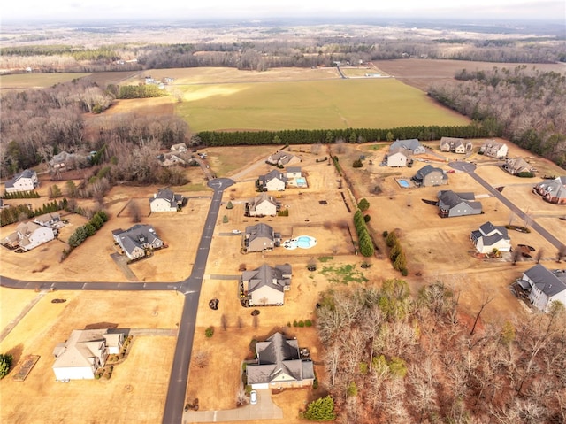 birds eye view of property with a rural view