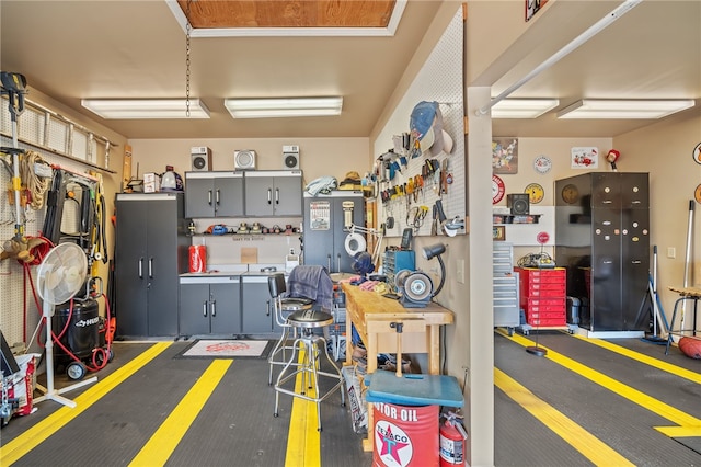 garage with a workshop area