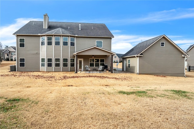 back of house featuring ceiling fan, a patio area, and central air condition unit