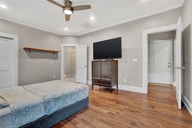 bedroom featuring ceiling fan, light wood-type flooring, and crown molding