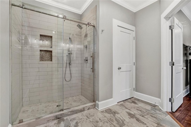 bathroom featuring a shower with door and ornamental molding