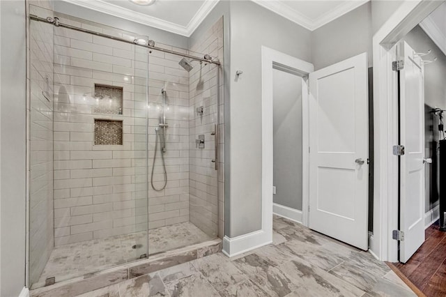 bathroom with an enclosed shower and ornamental molding