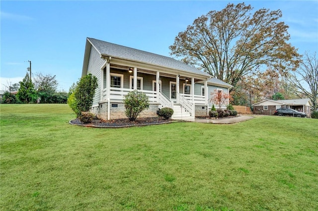 view of front of home with a front yard and a porch