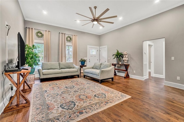 living room featuring ceiling fan and wood-type flooring