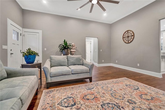 living room with ceiling fan and dark wood-type flooring