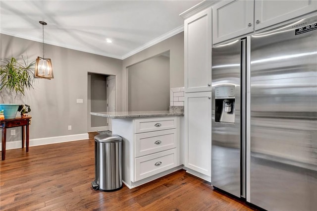 kitchen with white cabinetry, built in refrigerator, dark wood-type flooring, and light stone countertops