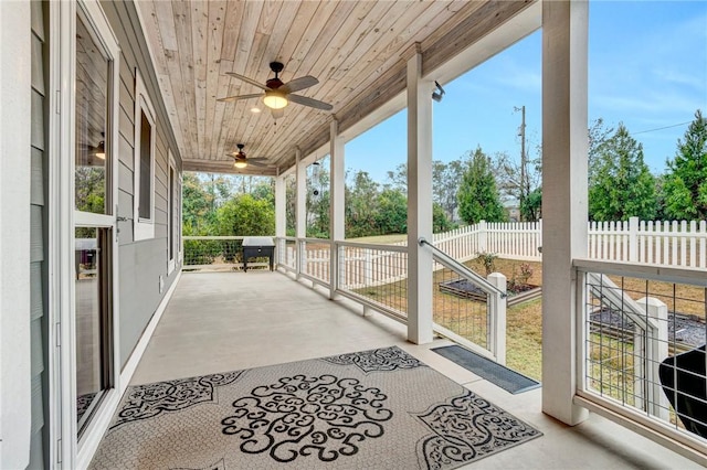 sunroom / solarium featuring wood ceiling