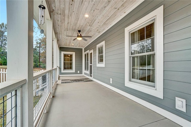 view of patio featuring ceiling fan and a porch