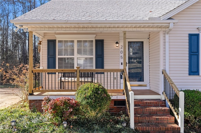 entrance to property featuring a porch