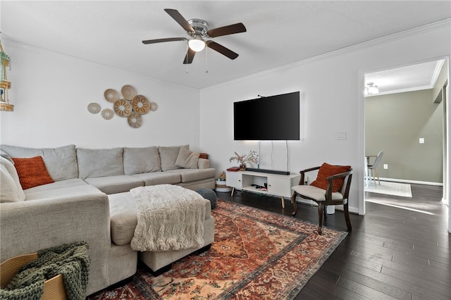 living room featuring ceiling fan, dark hardwood / wood-style flooring, and crown molding