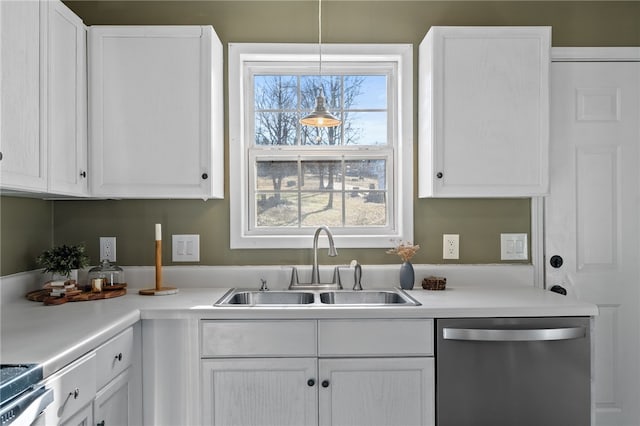 kitchen featuring dishwasher, white cabinets, and sink