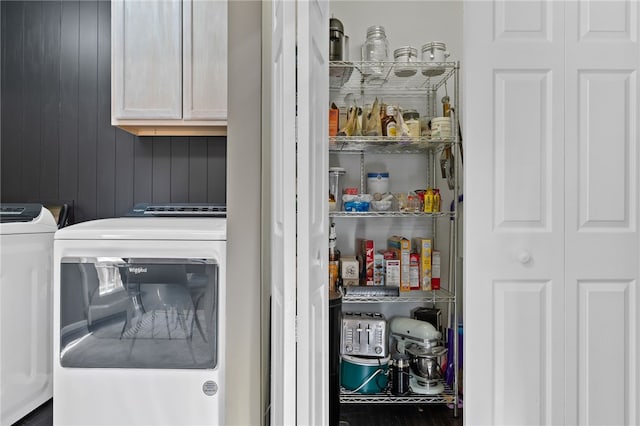 pantry with washer and clothes dryer