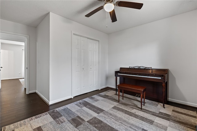 miscellaneous room with dark hardwood / wood-style floors and ceiling fan