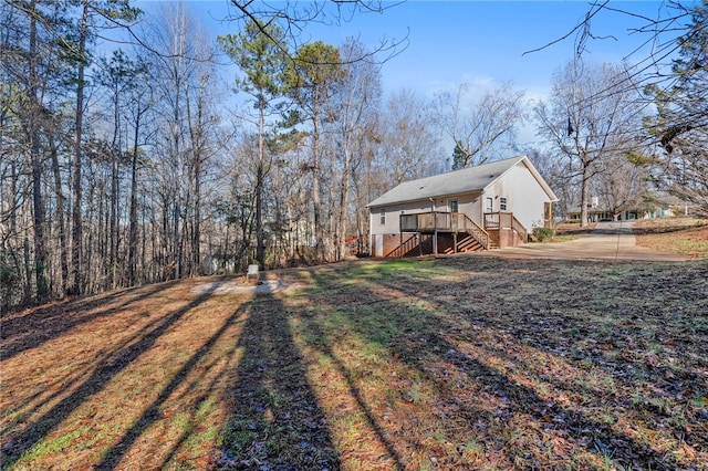 view of yard featuring a wooden deck