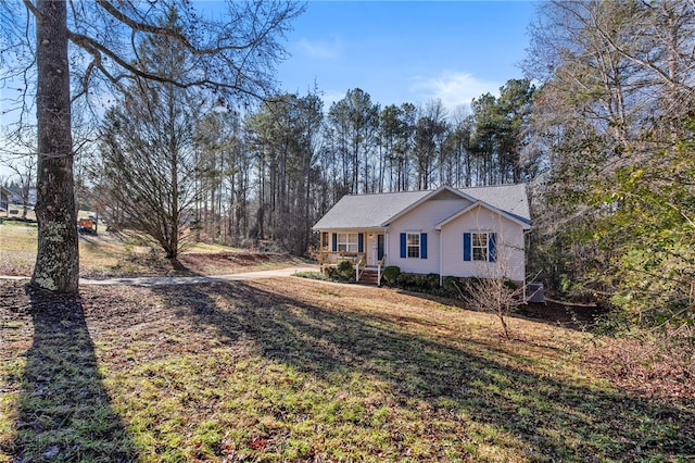 view of front of property with a front lawn and covered porch