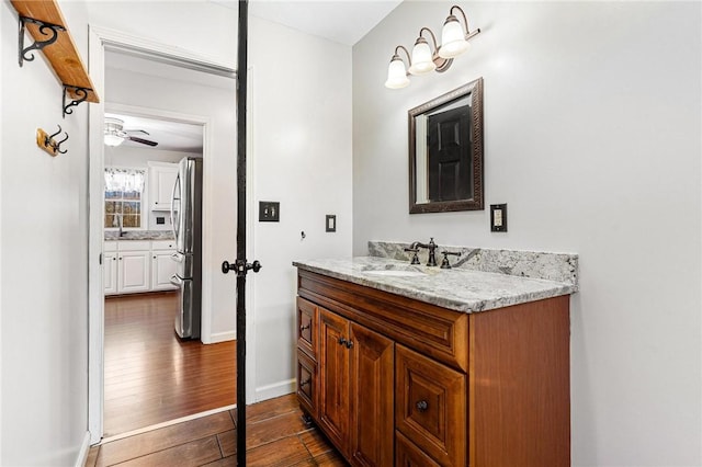 bathroom with vanity and hardwood / wood-style floors