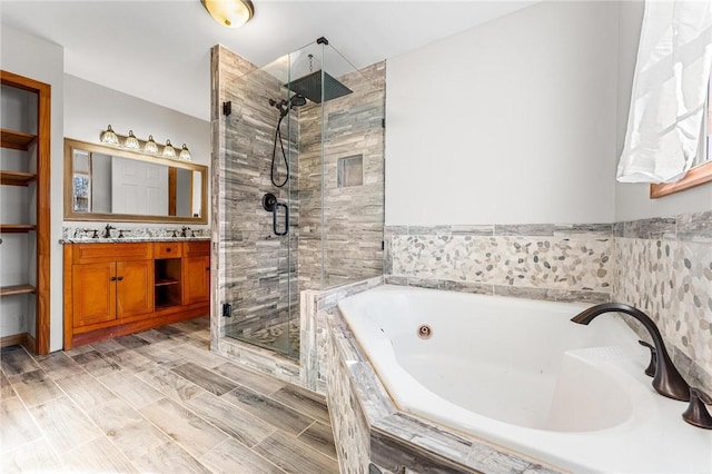 bathroom featuring vanity and separate shower and tub