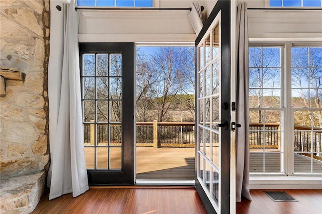 doorway featuring dark wood-type flooring and french doors