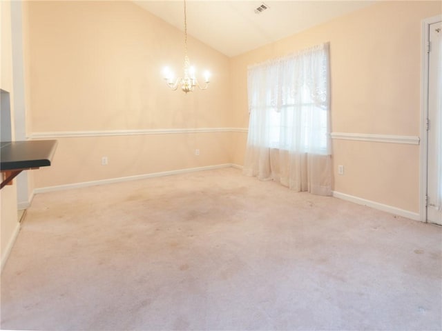 unfurnished dining area with carpet flooring, an inviting chandelier, and vaulted ceiling