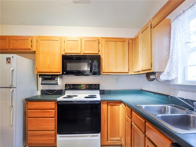 kitchen featuring sink and white appliances