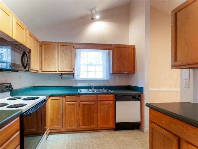 kitchen featuring vaulted ceiling, sink, and white appliances