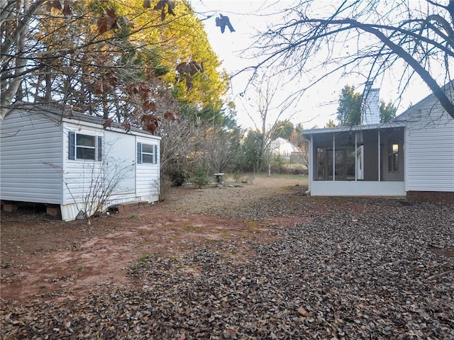 view of yard with a sunroom