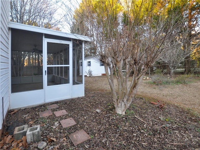 view of yard with a sunroom