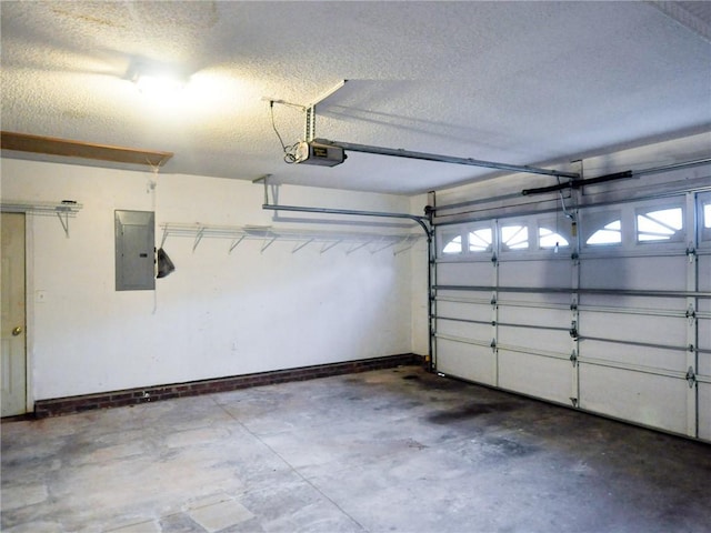 garage with a garage door opener and electric panel