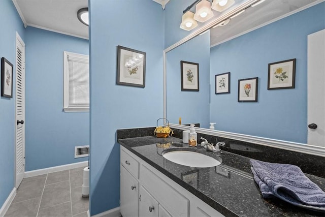 bathroom featuring ornamental molding, tile patterned floors, and vanity