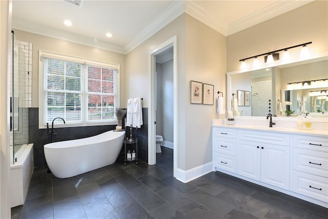 bathroom featuring vanity, toilet, a bathing tub, and crown molding