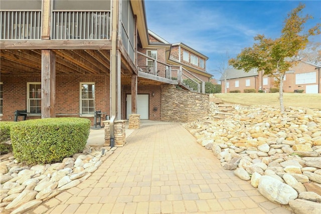 view of home's exterior featuring a balcony