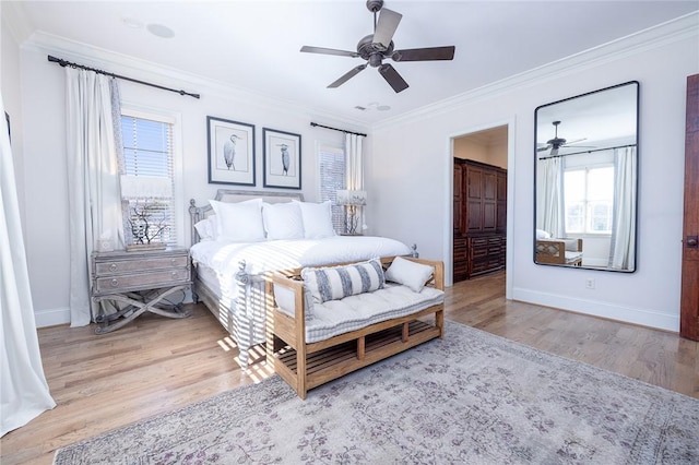 bedroom with light hardwood / wood-style floors, ceiling fan, and ornamental molding