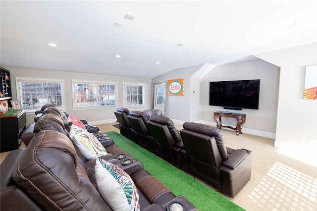 home theater featuring carpet floors and lofted ceiling