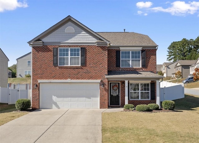 traditional-style home featuring a garage, driveway, fence, and a gate