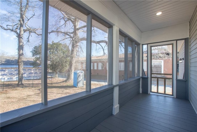 unfurnished sunroom featuring wood ceiling