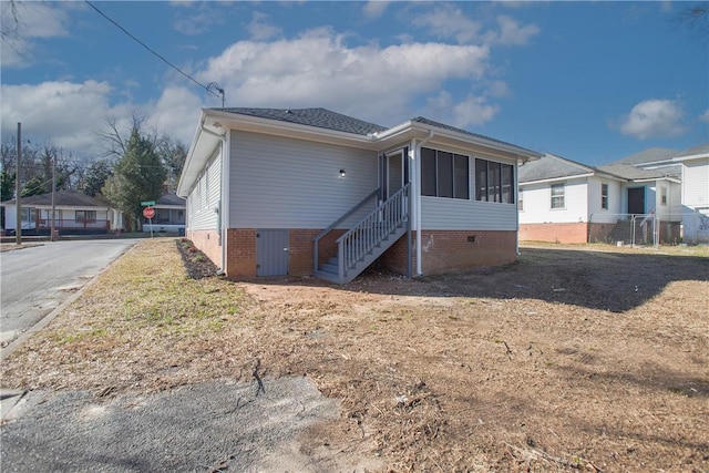 back of property featuring a sunroom