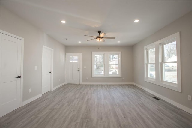 interior space featuring light hardwood / wood-style floors and ceiling fan