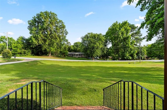 surrounding community featuring a yard