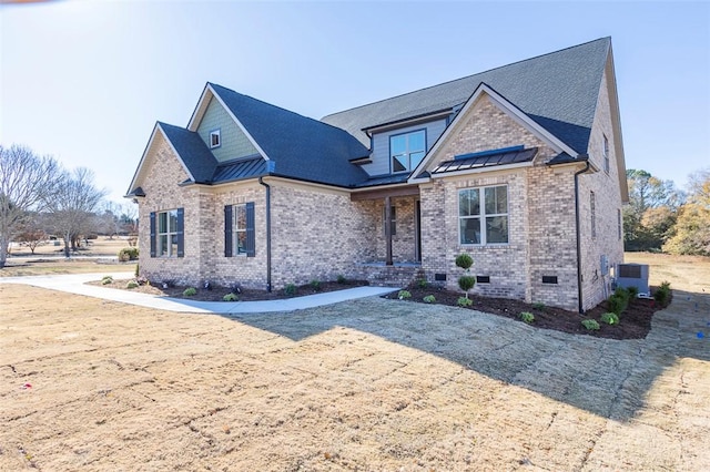 view of front of home featuring crawl space, metal roof, and a standing seam roof