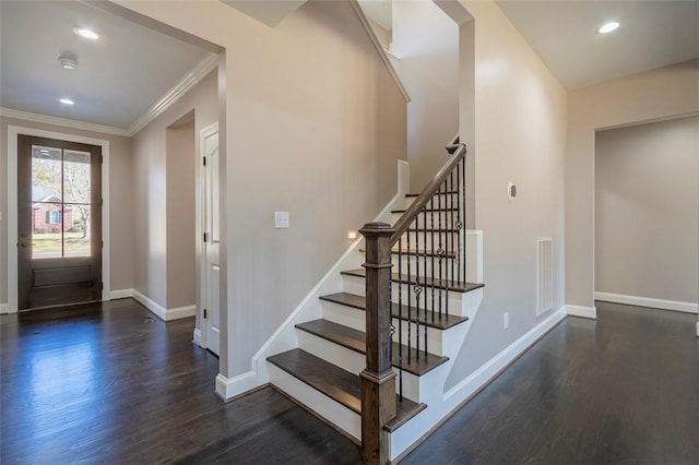 entrance foyer with wood finished floors, baseboards, visible vents, recessed lighting, and crown molding