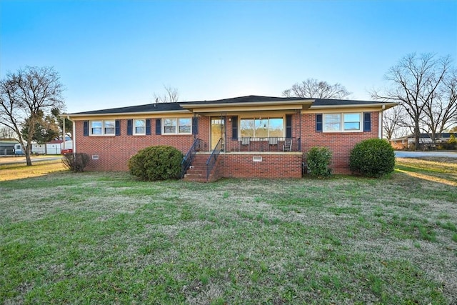 view of front of home with covered porch and a front yard