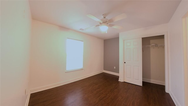 unfurnished bedroom featuring a closet, ceiling fan, and dark hardwood / wood-style floors