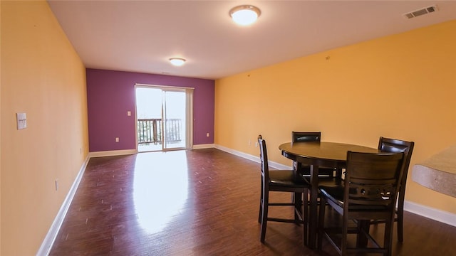 dining room with dark wood-type flooring