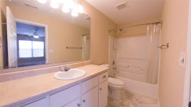 full bathroom featuring ceiling fan, shower / bath combo with shower curtain, vanity, and toilet