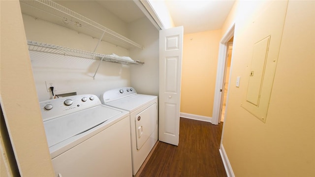 clothes washing area with electric panel, dark wood-type flooring, and independent washer and dryer