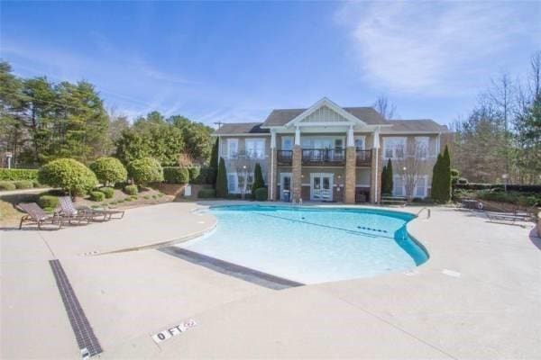 view of pool featuring a patio