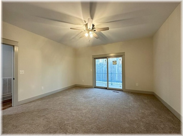 empty room featuring carpet and ceiling fan