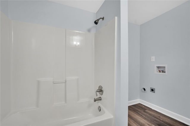 bathroom featuring hardwood / wood-style flooring and tub / shower combination