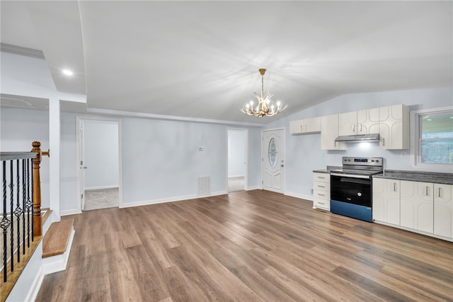 kitchen with lofted ceiling, an inviting chandelier, white cabinets, hanging light fixtures, and stainless steel electric range oven