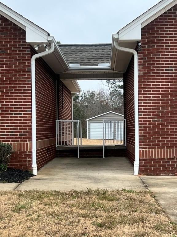 view of side of property with a garage and an outdoor structure